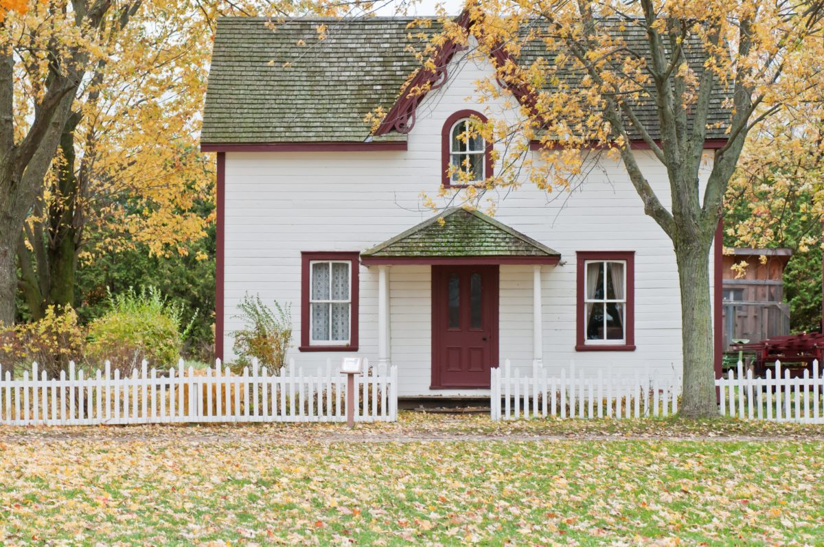 A beautiful inherited house with a large front yard.