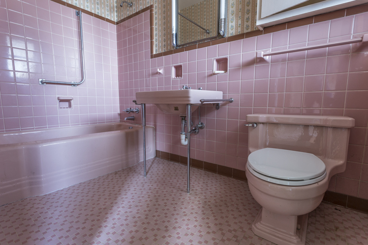 An ugly, outdate pink bathroom. We buy unappealing houses.